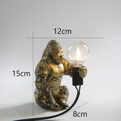 Modern gold king kong resin night light featuring a textured golden gorilla figurine holding a clear bulb for decorbites king kong