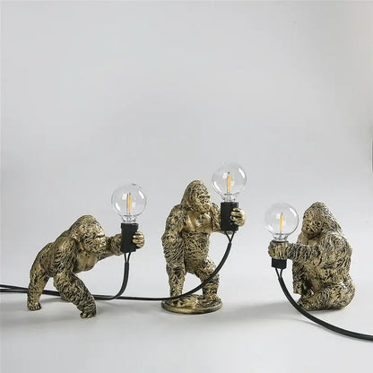 Three golden king kong resin night light figurines holding edison filament bulbs for modern decorbites bedroom lamp