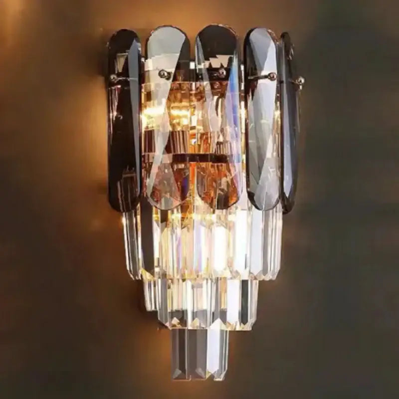 Modern gold leaf crystal wall lamp with cascading clear and amber prisms and black mirrored accents for bedroom decorbites crystal wall lighting