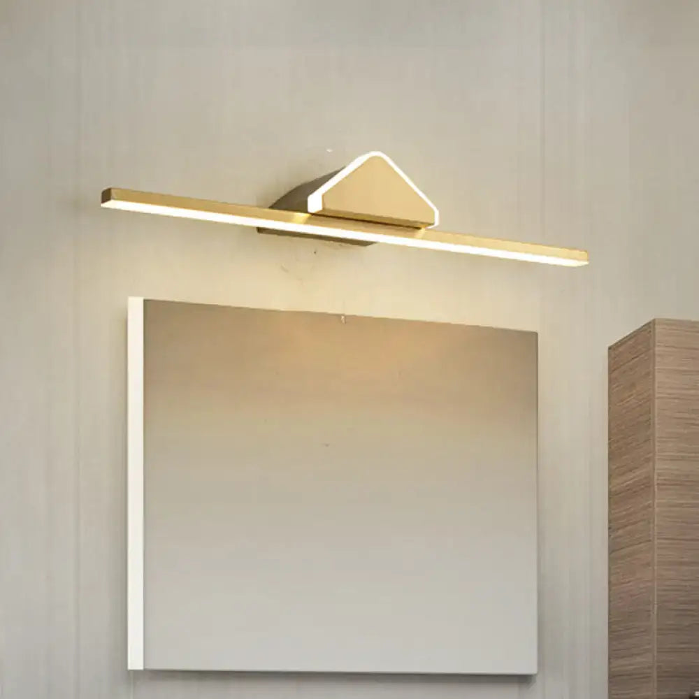 Modern gold-toned led wall light with sleek rectangular bar and triangular accent bulb included for bedroom vanity use