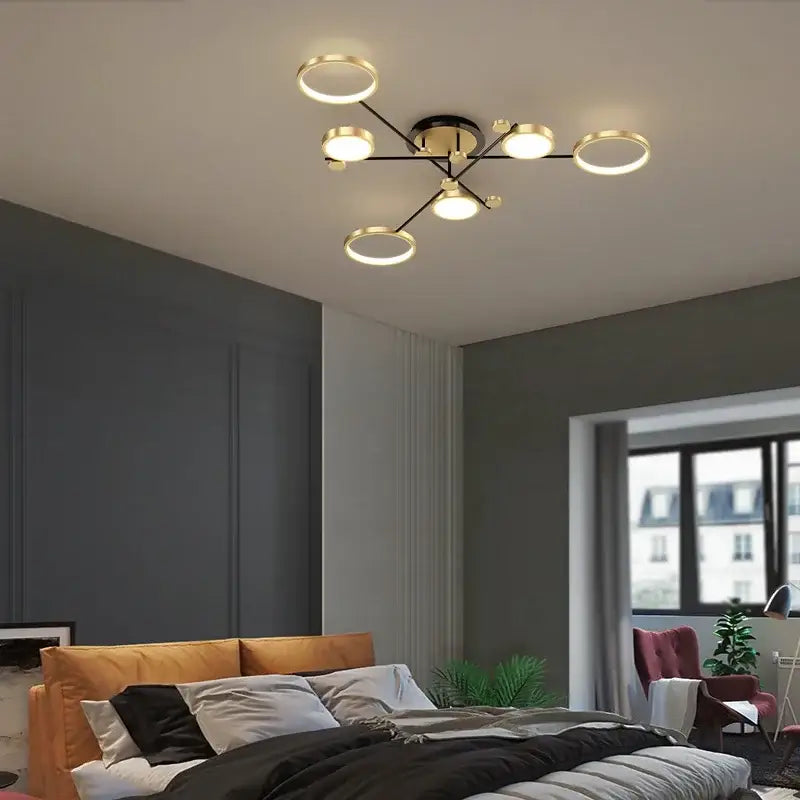 Modern gold led ceiling lamp with black and gold finish and geometric circular and spherical bulbs for living room