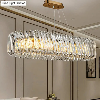 DecorBites™ led island pendant featuring a gold ceiling mount and clear crystal shade with hanging rods