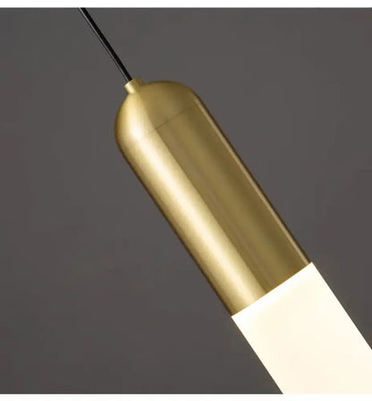 A sleek modern pendant lamp with a brushed brass top and frosted glass diffuser by decorbites gold led for bedroom and kitchen lighting