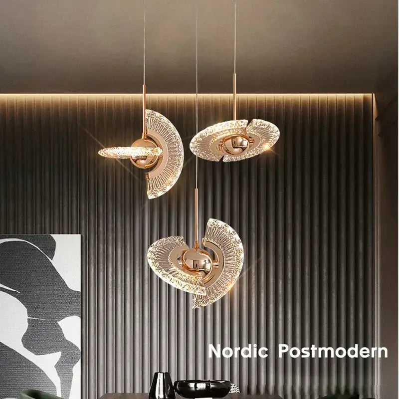 Three elegant gold led pendant lights with fan-shaped glass shades in modern nordic postmodern dining room decorbites gold led design