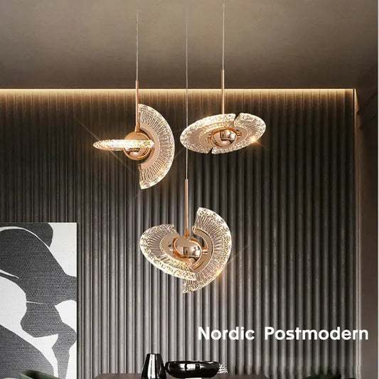 Three elegant gold led pendant lights with fan-shaped glass shades in modern nordic postmodern dining room decorbites gold led design