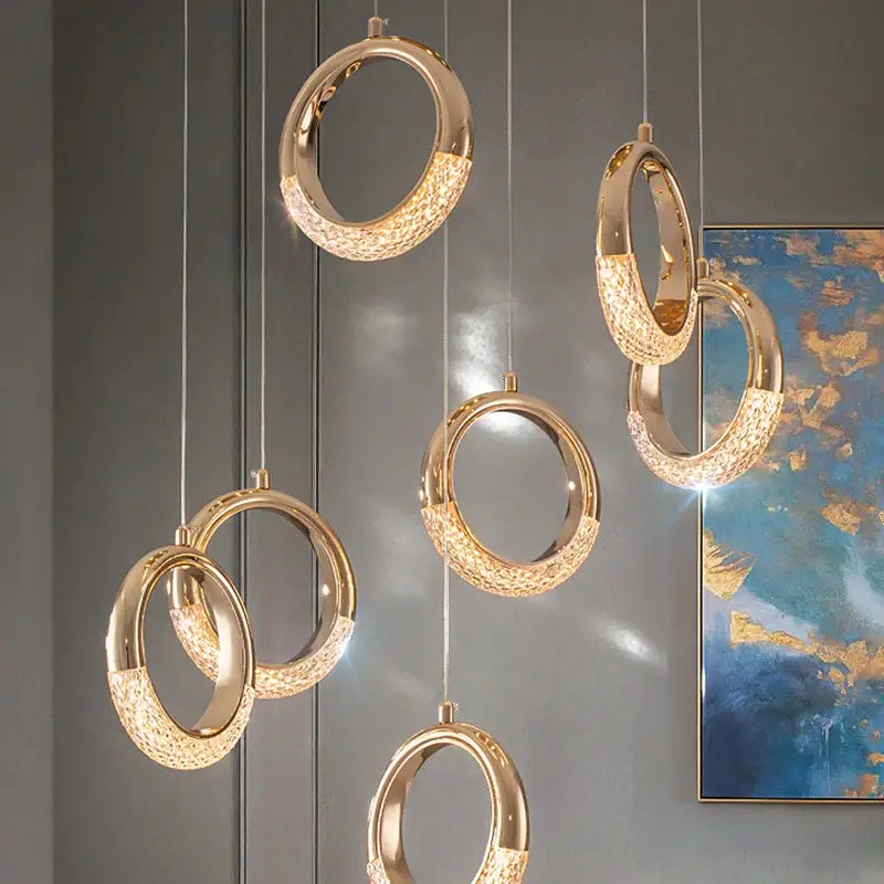 Modern gold led pendant light with gold-toned circular design and crystal-encrusted lower half for dining room decorbites gold led
