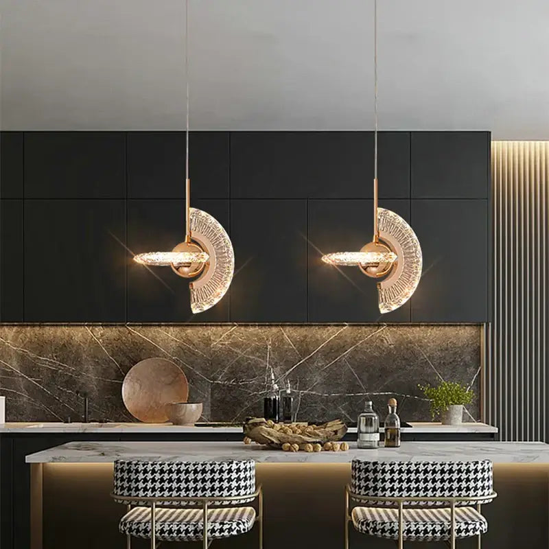 Two elegant gold led pendant lights with metal frames and faceted crystal glass shades for dining room decorbites gold led