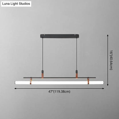 Modern gold led pendant light with leather and copper hardware featuring a white cylindrical led lamp for dining room use
