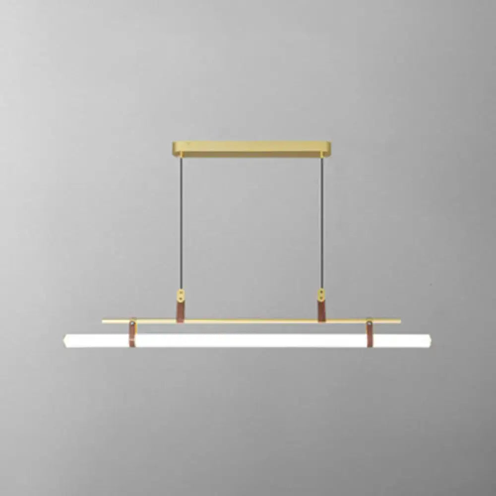 Modern gold led pendant light with sleek metal frame and brown leather straps for dining room use