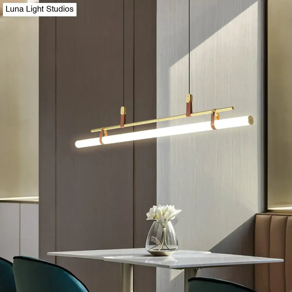 Modern gold led pendant light with leather straps featuring a sleek design for dining room illumination