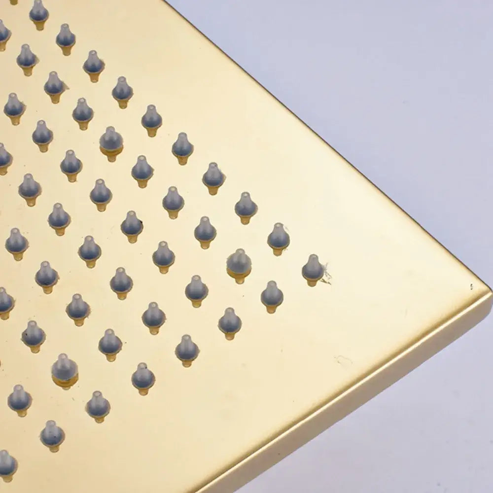 Modern gold led rainfall shower head with a gold-colored square design and evenly spaced nozzles for shower head decorbites gold led