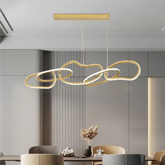 Modern gold led ring chandelier with interconnected flowing rings suspended from rectangular ceiling mount for dining room decorbites gold led