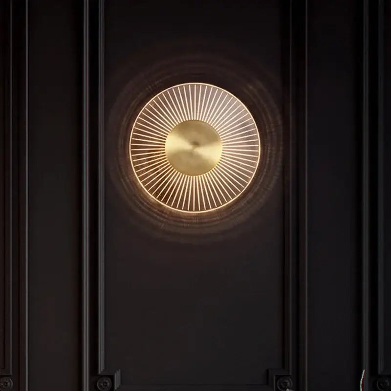 Modern gold led round wall lamp with a brass disc and warm glow for bedroom sconce lighting by decorbites gold led
