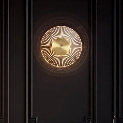 Modern gold led round wall lamp with a brass disc and warm glow for bedroom sconce lighting by decorbites gold led