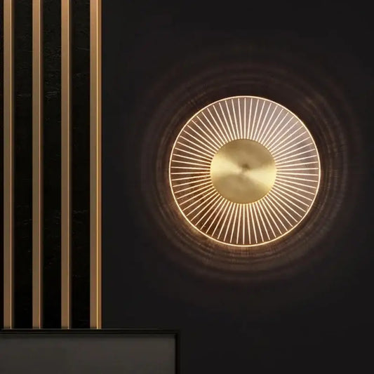 Modern gold led round wall lamp with gold-toned circular sconce and radiant led light rays for bedroom decorbites gold led