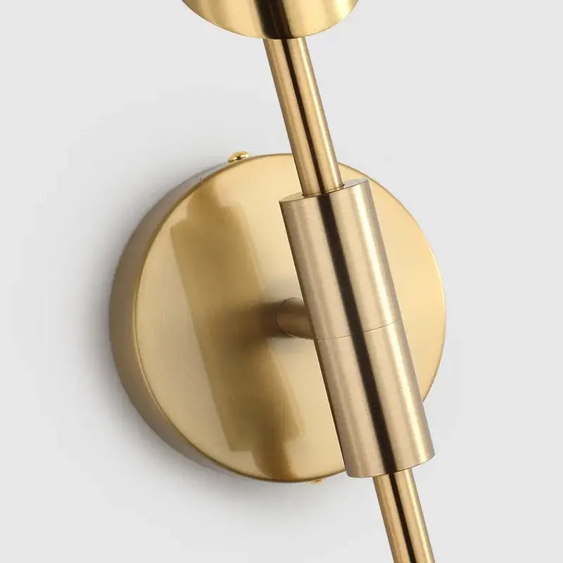 Modern gold led single head wall lamp with brass finish cylindrical stem and circular base for bedroom decorbites gold led wall lamp