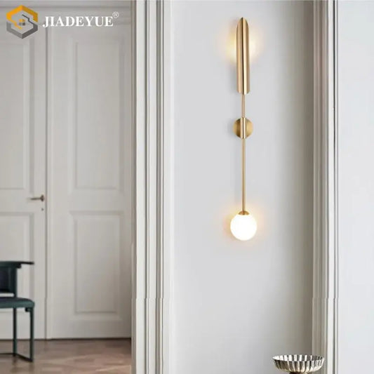 Modern gold led single wall lamp with sleek vertical design and illuminated glass bulb for bedroom decorbites gold led