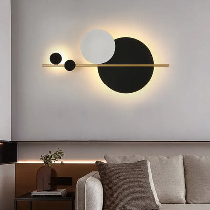 Modern gold led wall lamp with black and white circular shades on a slender bar for elegant bedroom decorbites led wall use