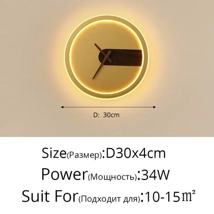 Modern gold led wall lamp clock with glowing golden frame and dark wood hands illuminated by led wall lighting