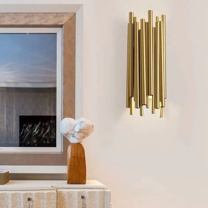 Modern gold led wall lamp with brass rod sconce and vertical cylindrical tubes for living room decorbites gold led design