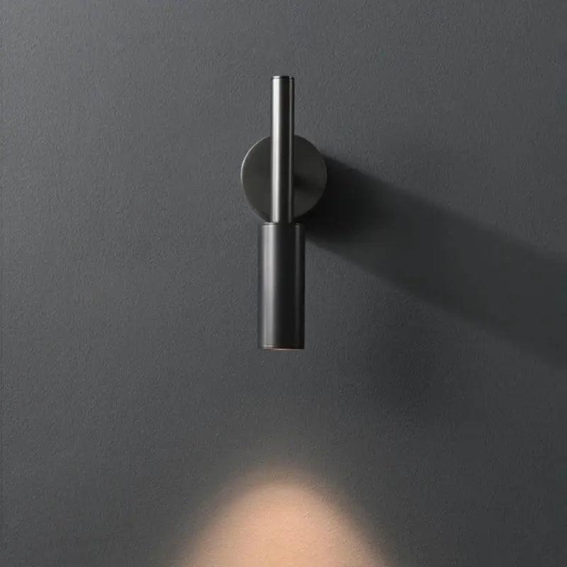 Minimalist black matte led wall lamp with cylindrical design and adjustable color temperature for modern bedroom lighting