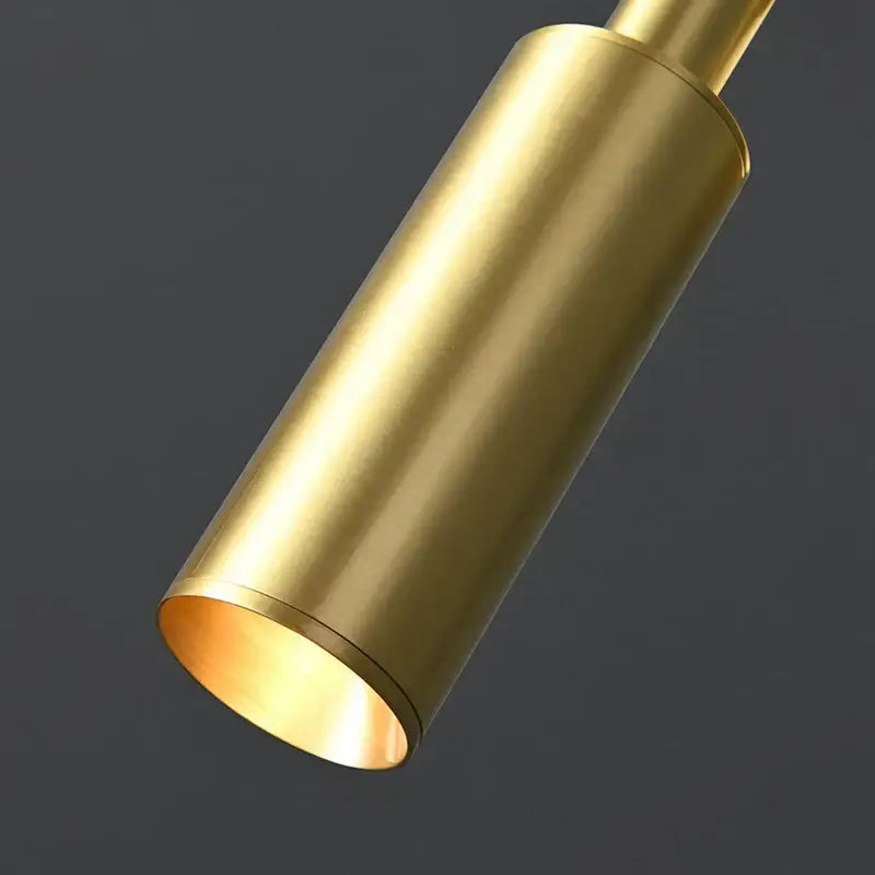 Modern gold led wall lamp with cylindrical brass design polished finish and adjustable color temperature for bedroom use