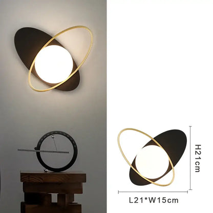 Modern gold and black led wall lamp with frosted glass and glowing circular light for living room use