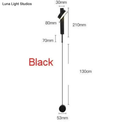 Black modern led wall lamp with sleek metallic finish and minimalist design featuring rotating sconce light for bedroom