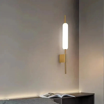 Modern gold led wall light with frosted glass cylinder and minimalist design for bedroom wall light installation