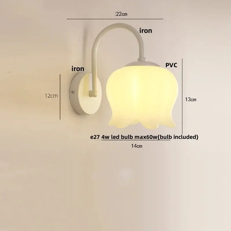 Modern gold led wall sconce with frosted pvc shade and curved iron arm for stairway lighting as a soft yellow tulip shape led wall