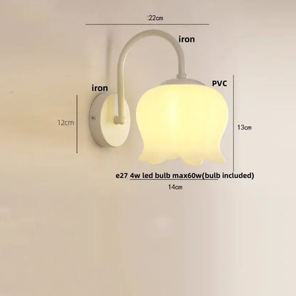 Modern gold led wall sconce with frosted pvc shade and curved iron arm for stairway lighting as a soft yellow tulip shape led wall
