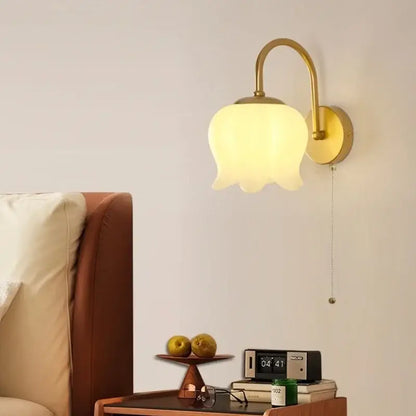 Modern gold led wall sconce with frosted glass tulip shade designed for decorative stairway lighting