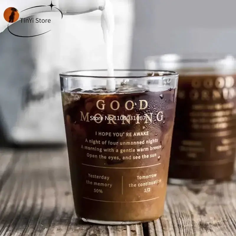 Clear glass decorbites glass breakfast cup with gold foil lettering filled with iced coffee for kitchen use