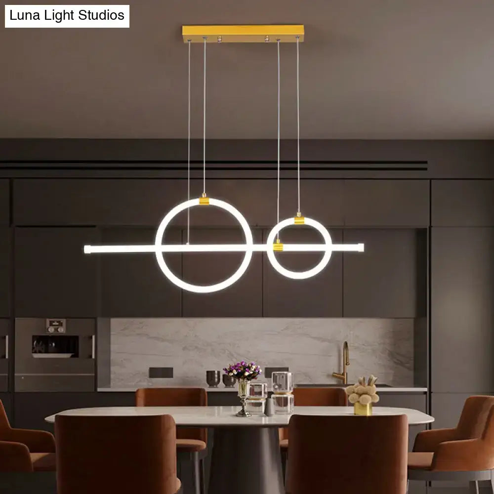Modern minimalist gold linear pendant light with two glowing ring led circles and acrylic design for dining room
