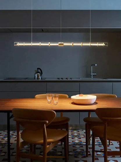 Modern gold linear glass chandelier with sleek metallic frame and warm illumination for dining room decorbites glass chandelier