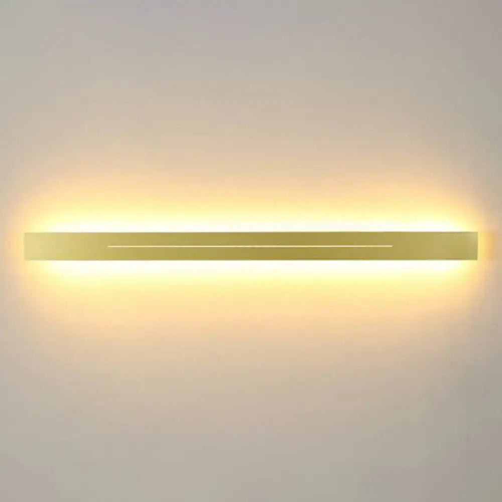 Modern gold linear led wall light fixture with sleek rectangular design and warm ambient glow for living room use
