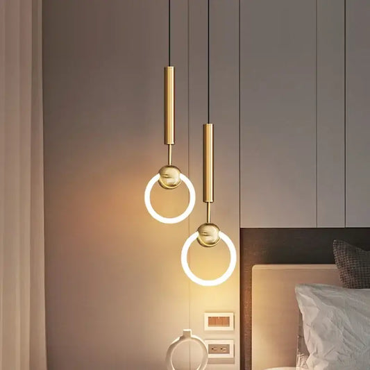 Modern gold linear ring pendant light with circular led rings and cylindrical fixtures for modern interiors