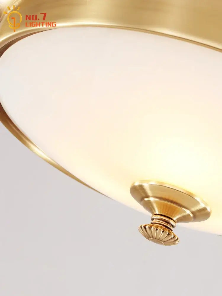 Modern gold lustre copper ceiling lamp with gold-toned brass ornate fluted base and frosted glass shade for living room