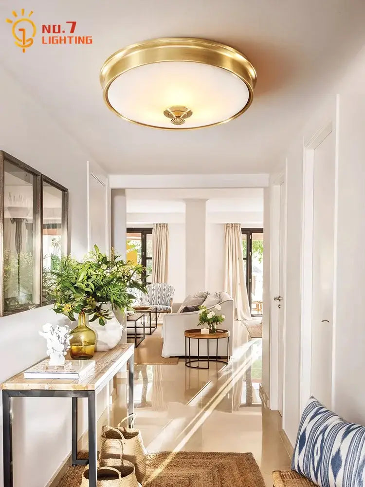 Modern gold lustre copper ceiling lamp with a gold-toned circular design and frosted glass diffuser for living room use