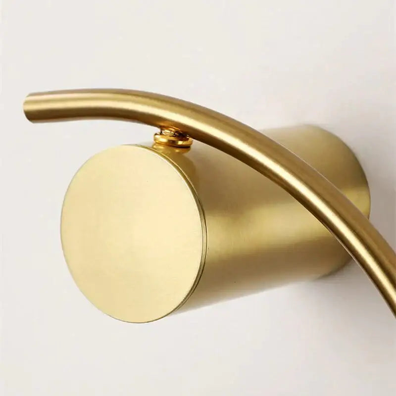 Modern gold luxury creative led bedside wall lamp with a gold-toned cylindrical curved faucet design for bedroom sconce