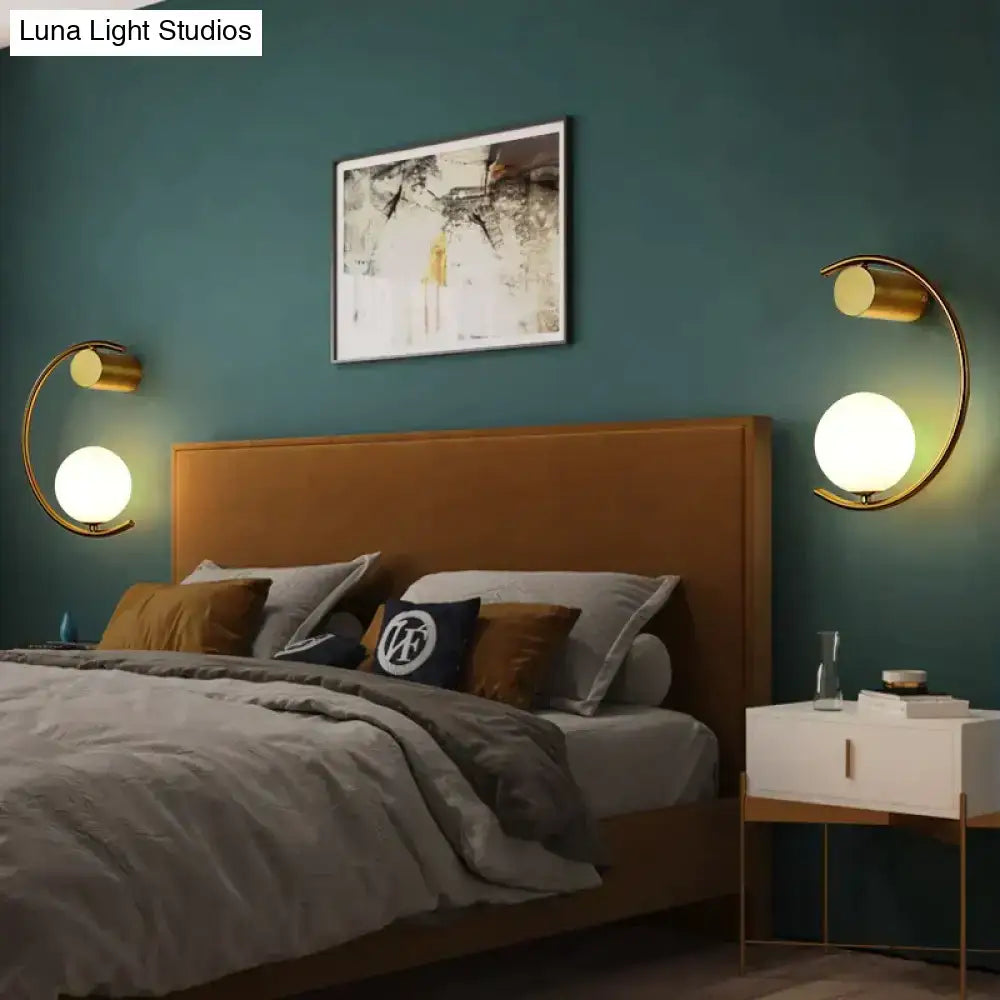 Modern gold luxury creative led bedside wall lamp with crescent gold-tone metal and frosted glass globe shades