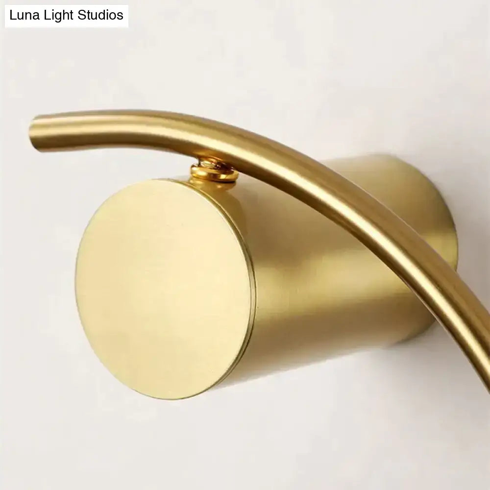 Modern gold luxury creative led bedside wall lamp with sleek curved arm and cylindrical base for bedroom sconce lighting