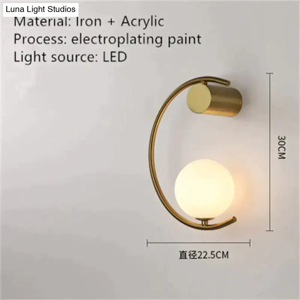 Modern gold luxury creative led bedside wall lamp with curved iron frame and frosted acrylic globe sconce