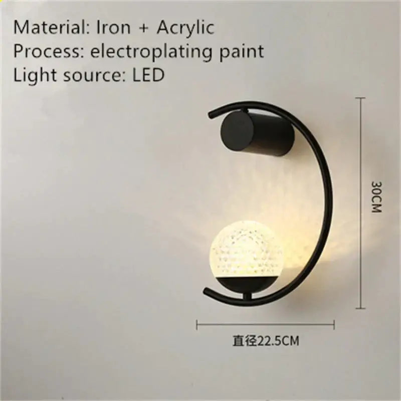 Black iron and acrylic luxury creative led bedside wall sconce with curved arm and textured spherical led-lit globe