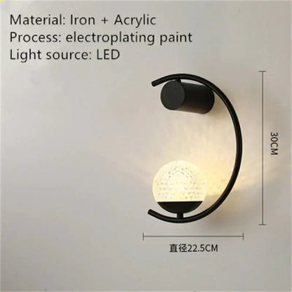 Black iron and acrylic luxury creative led bedside wall sconce with curved arm and textured spherical led-lit globe