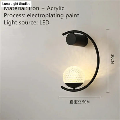 Black iron and acrylic luxury creative led bedside wall lamp with curved arm and illuminated textured globe sphere