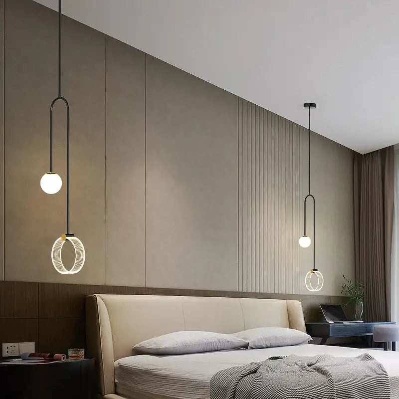Modern black pendant light with spherical bulbs and circular rings complements decorbites gold luxury led bedroom art