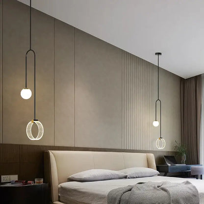 Modern black pendant light with spherical bulbs and circular rings complements decorbites gold luxury led bedroom art