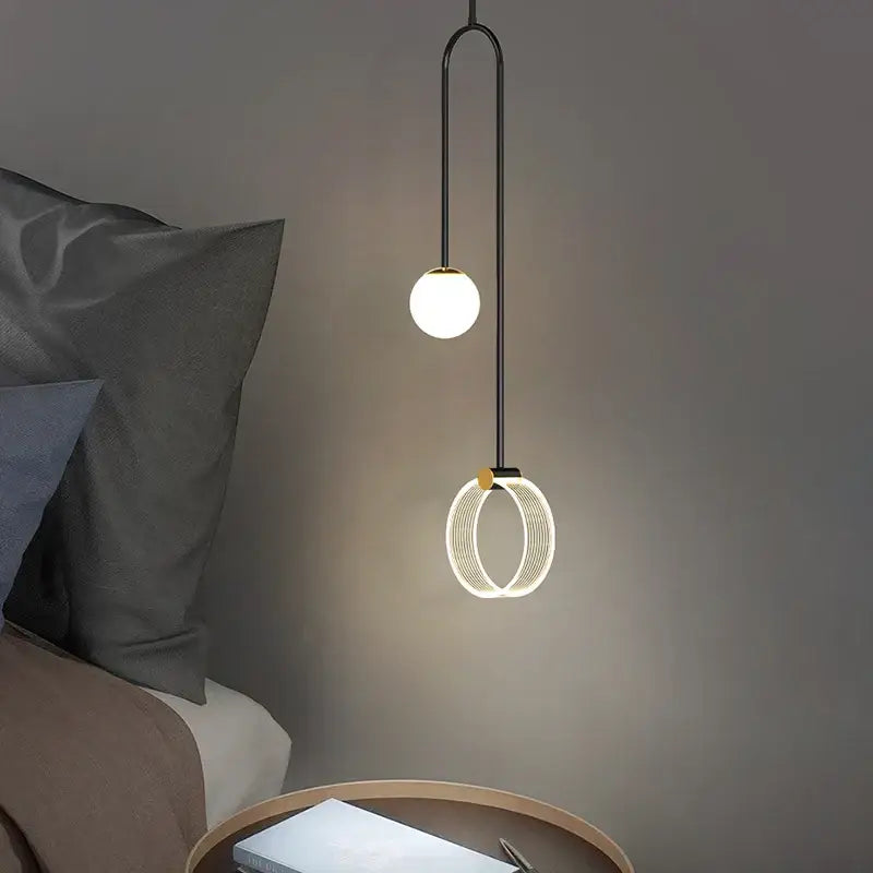 Modern black metal pendant light with spherical bulb and illuminated ring for decorbites gold luxury led bedroom decor