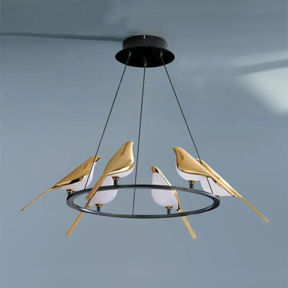 Modern gold magpie bird ceiling chandelier featuring a gold and white bird pendant with a black circular metal frame